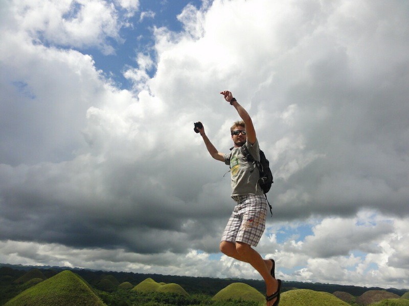 Bastiaan jumping at the Chocolate Hills in Bohol