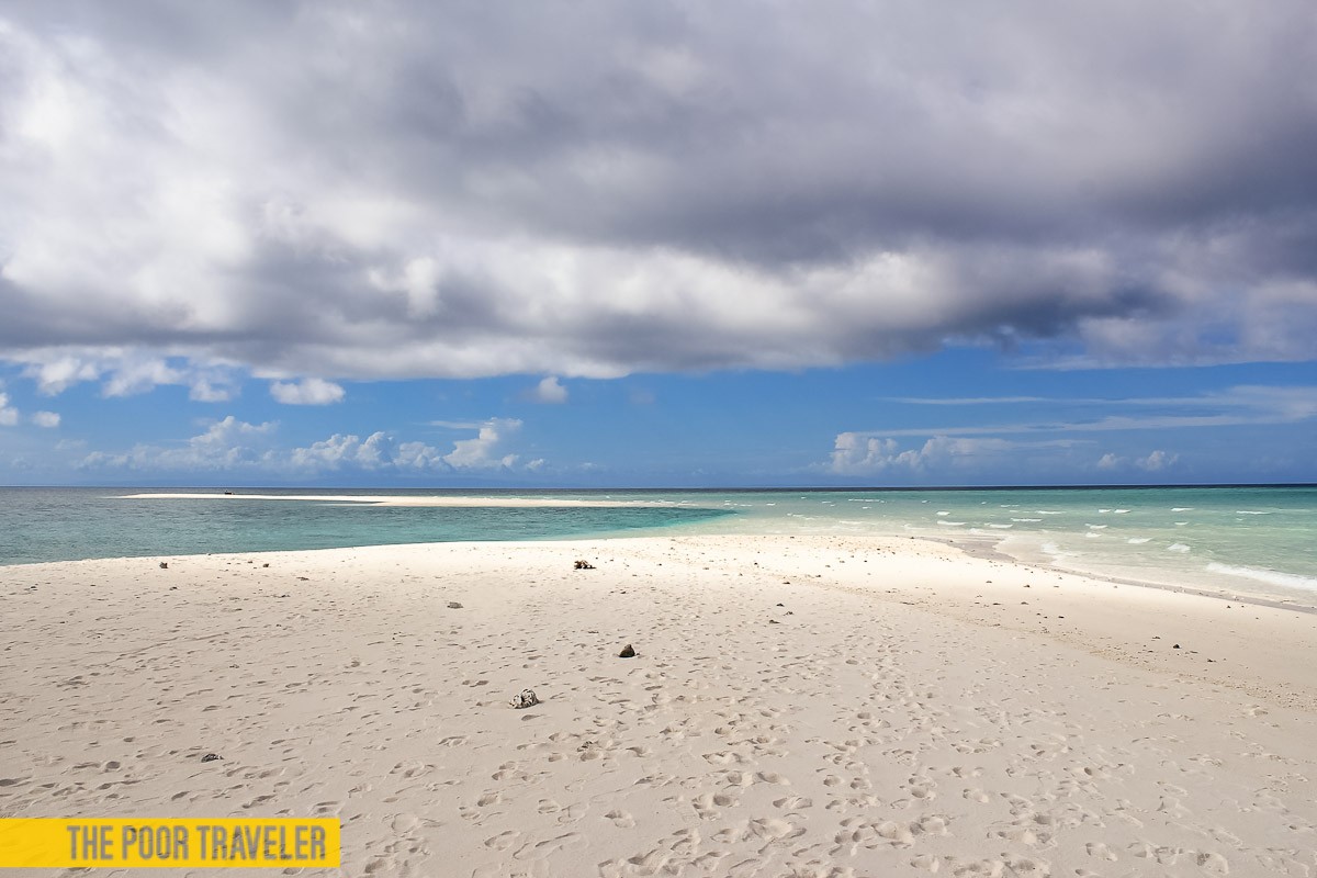 One side of the sandbar is quiet and gentle, the other has more violent waves