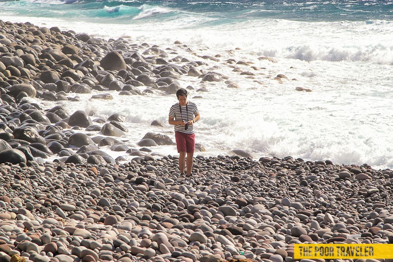 Swim and the waves will smash you onto the boulders. Keep walking!