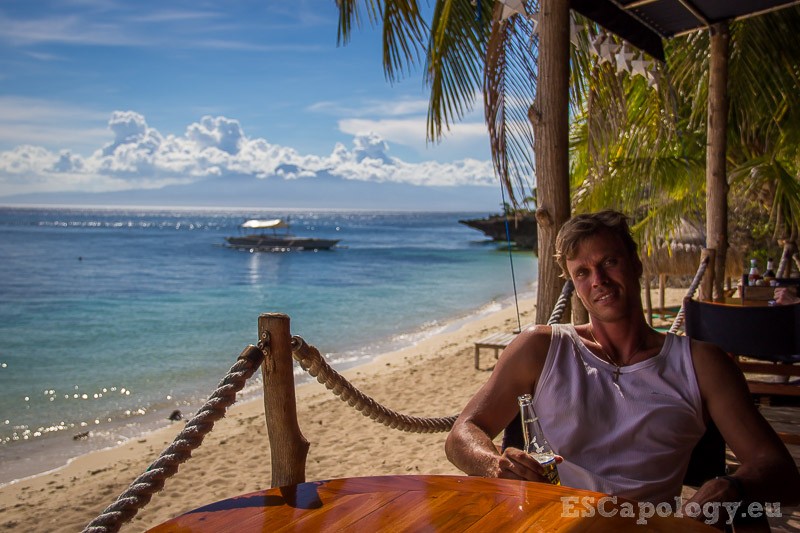 Enjoying a cold San Mig at the beach in Siquijor