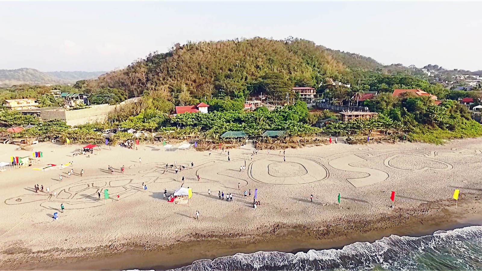 Participants working together to create the sand art.